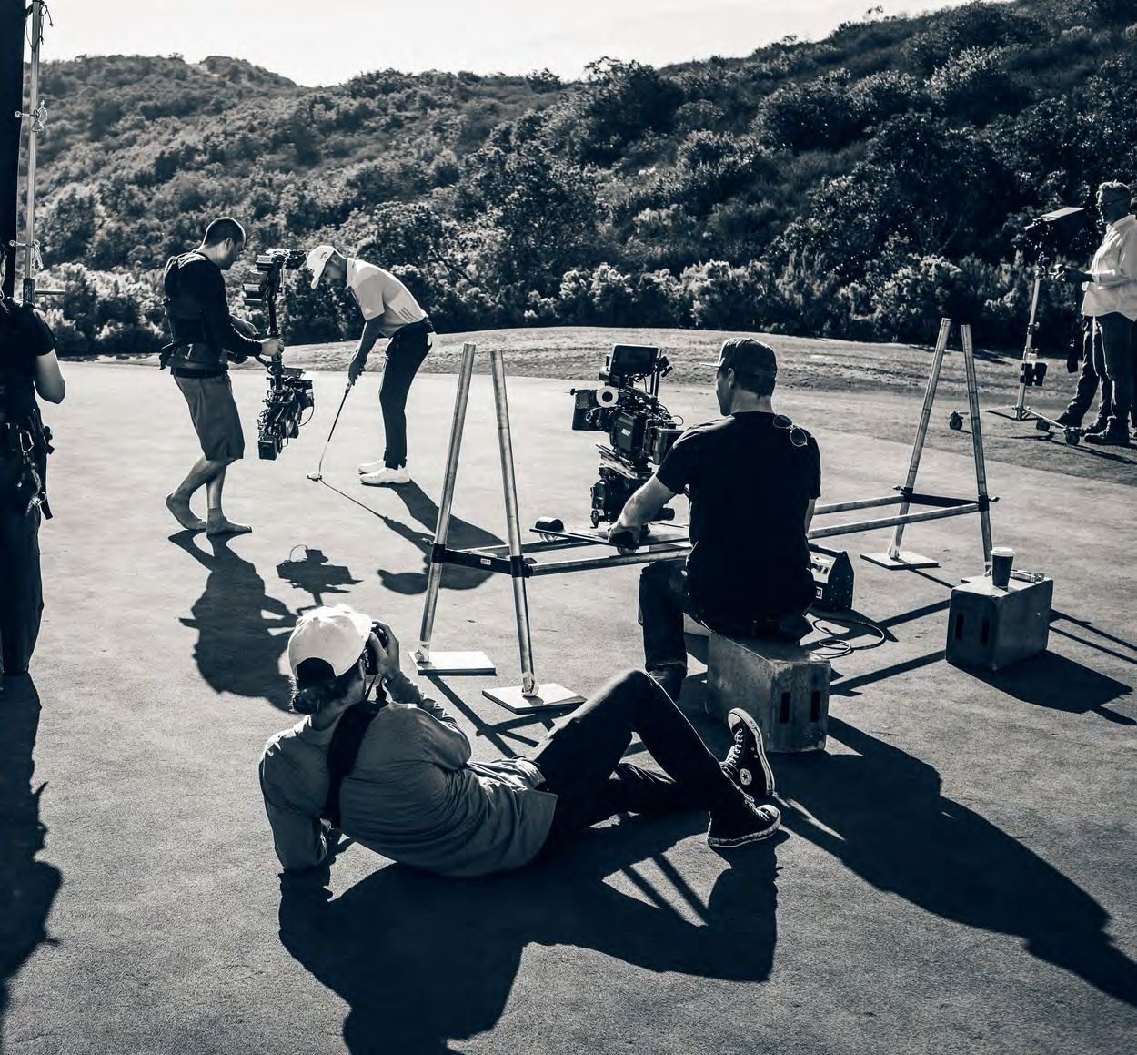 Behind the scenes with cinema cameras on a putting green