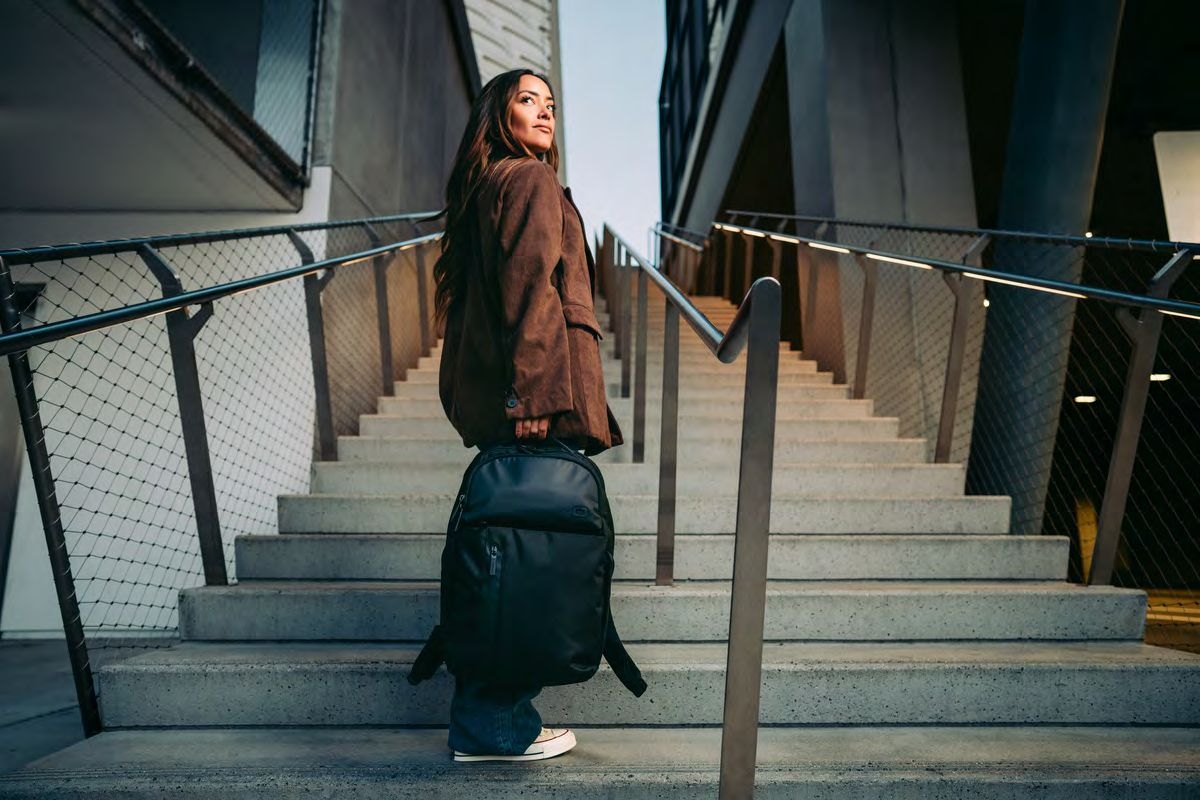 Woman with OGIO backpack on stairs